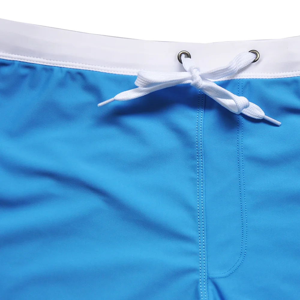 Traje de baño para hombre, pantalón corto de surf de cintura baja, sexy y con personalidad, con bolsillo, para natación y playa