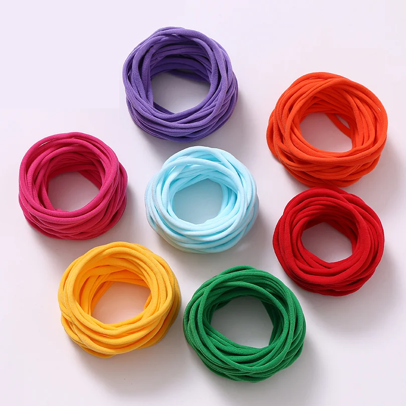 100 unids/lote bebé niña DIY elástico flaco Nylon chica elástico cena suave diadema accesorios para bebé sombreros infantiles artículos para bebé