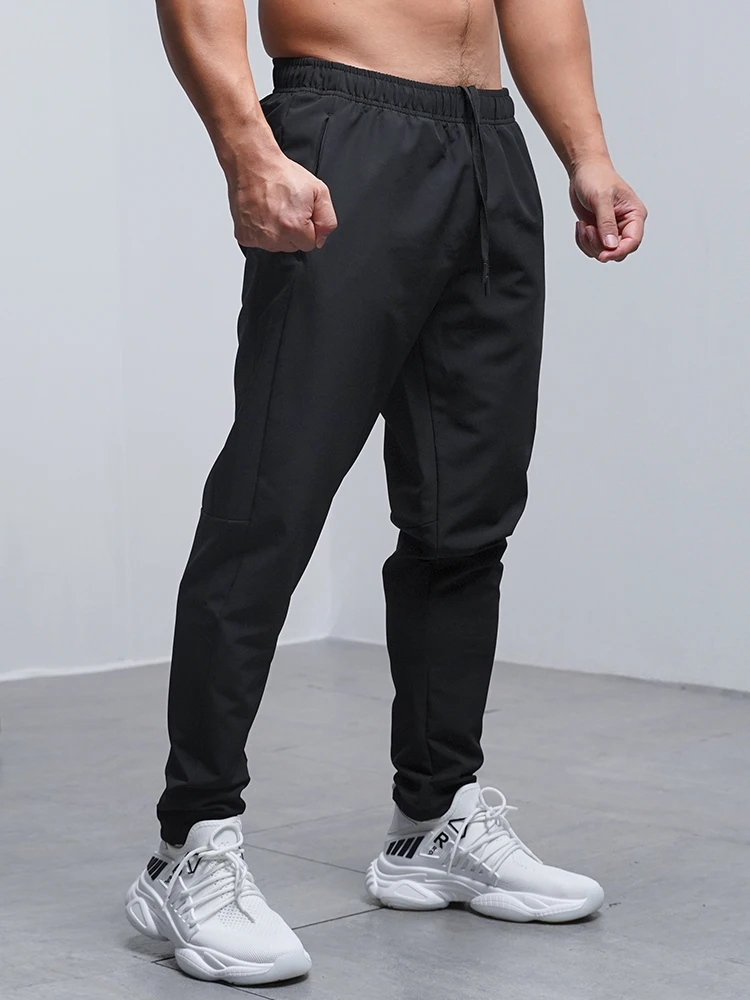 Pantalones Deportivos para Hombre, Transpirables, Holgados, para Correr, Entrenamiento, Gimnasio, Ropa Deportiva, Elásticos, Impermeables, con Bolsillos con Cierre, para Otoño e Invierno