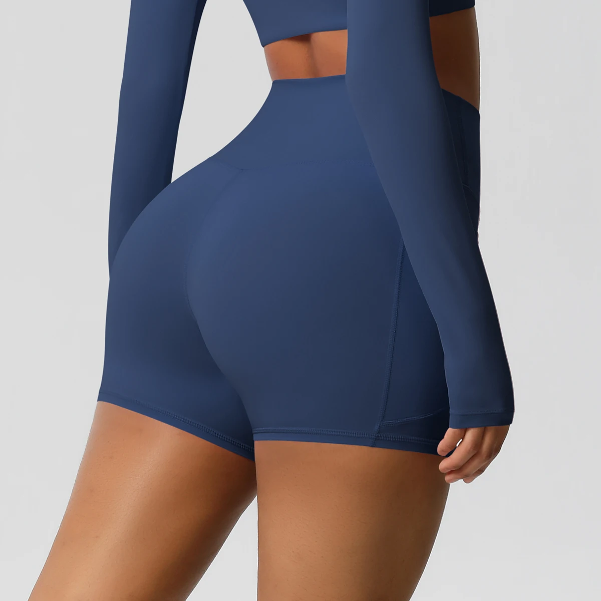 Pantalones cortos de nailon de Color sólido para mujer, pantalones cortos para levantar la barriga, ciclismo al aire libre, correr con bolsillos, pantalones cortos deportivos para gimnasio y Pilates