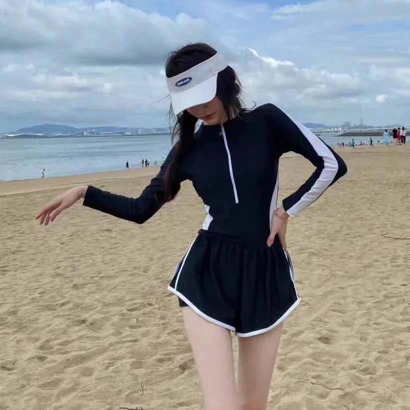 Traje de baño vendedor caliente para mujer, mono de verano de manga larga para niñas, traje de baño sexy de aguas termales, ocultando carne y adelgazar