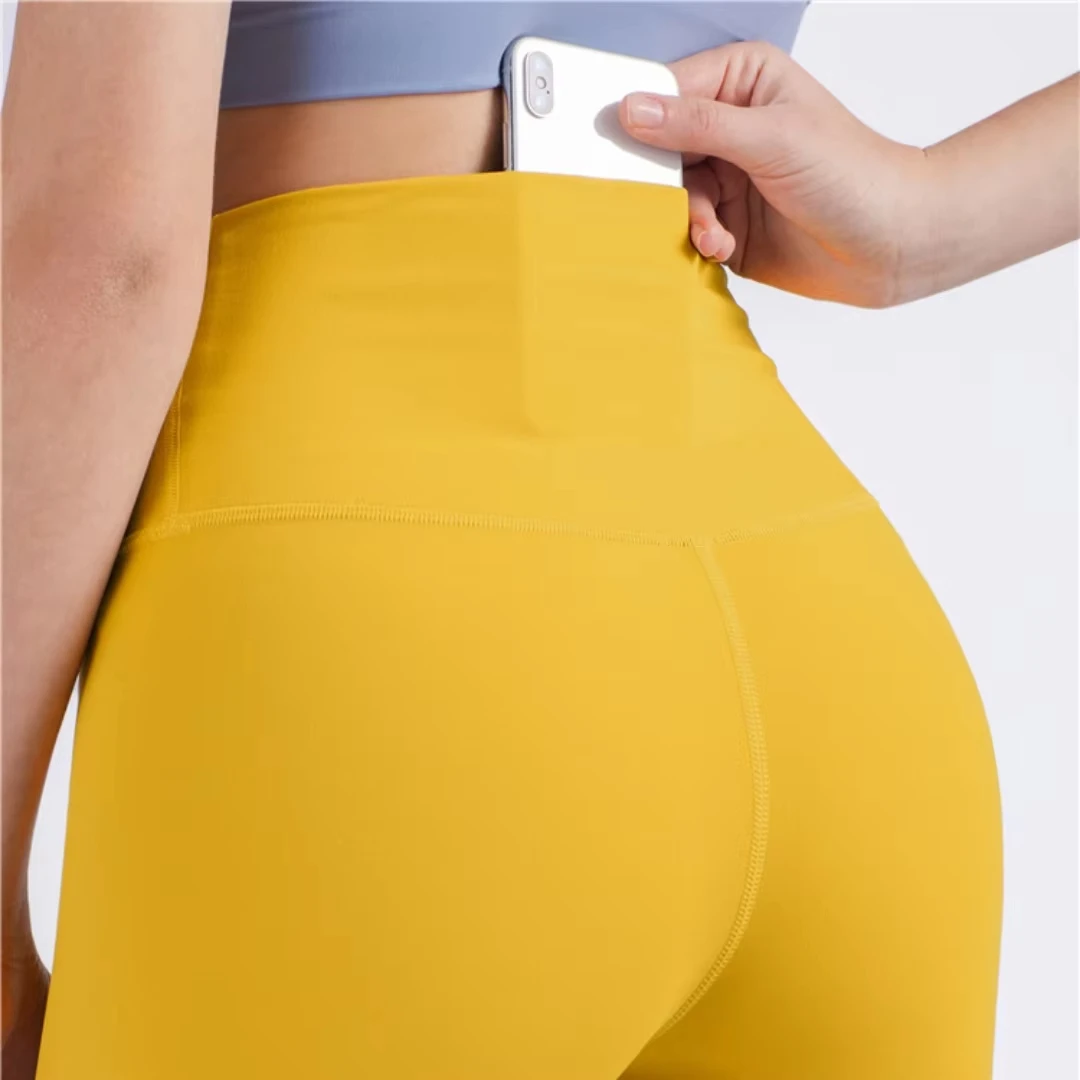 Legging de Yoga de cintura alta de Color sólido, pantalones deportivos suaves con bolsillo en la espalda para mujer, pantalones deportivos ajustados con mantequilla, gimnasio atlético, entrenamiento integral