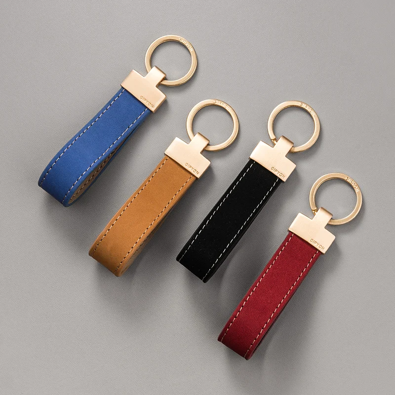 Exquisita cuerda de mango de alta calidad, colgante de llavero Simple de cuero de vaca, anillo de cadena de coche con personalidad, colgante para amantes de hombres y mujeres