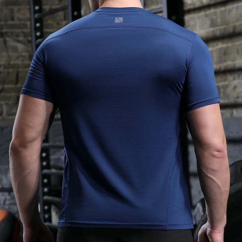 Camiseta deportiva de poliéster para hombre, camisa de compresión para correr, Fitness, gimnasio, entrenamiento al aire libre, ropa de ajuste muscular