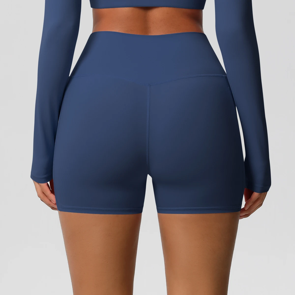 Pantalones cortos de nailon de Color sólido para mujer, pantalones cortos para levantar la barriga, ciclismo al aire libre, correr con bolsillos, pantalones cortos deportivos para gimnasio y Pilates