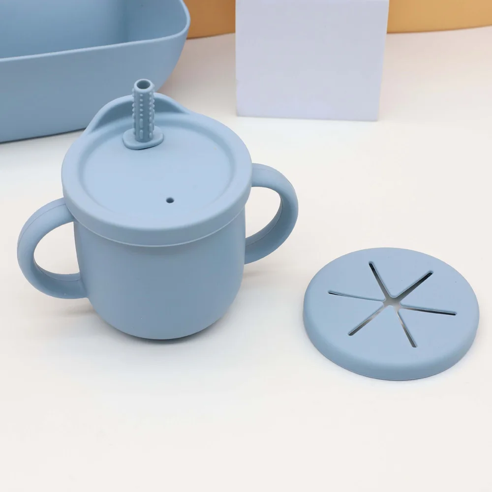 Juego de vajilla de silicona para bebé de 7 piezas, babero, plato, tazón con ventosa, vaso 2 en 1, taza para refrigerios, cuchara y tenedor de madera