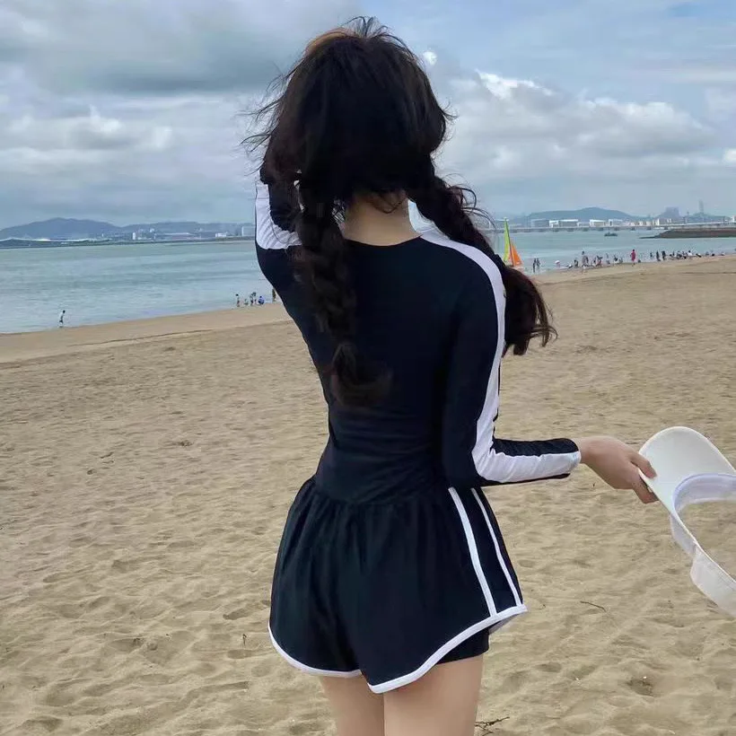 Traje de baño vendedor caliente para mujer, mono de verano de manga larga para niñas, traje de baño sexy de aguas termales, ocultando carne y adelgazar