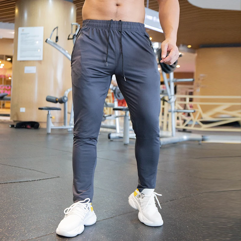 Pantalones Deportivos para Hombre, Otoño-Verano 2026, Transpirables, con Spandex, para Correr, Entrenamiento, Gimnasio, Elásticos, de Secado Rápido, con Bolsillos con Cierre