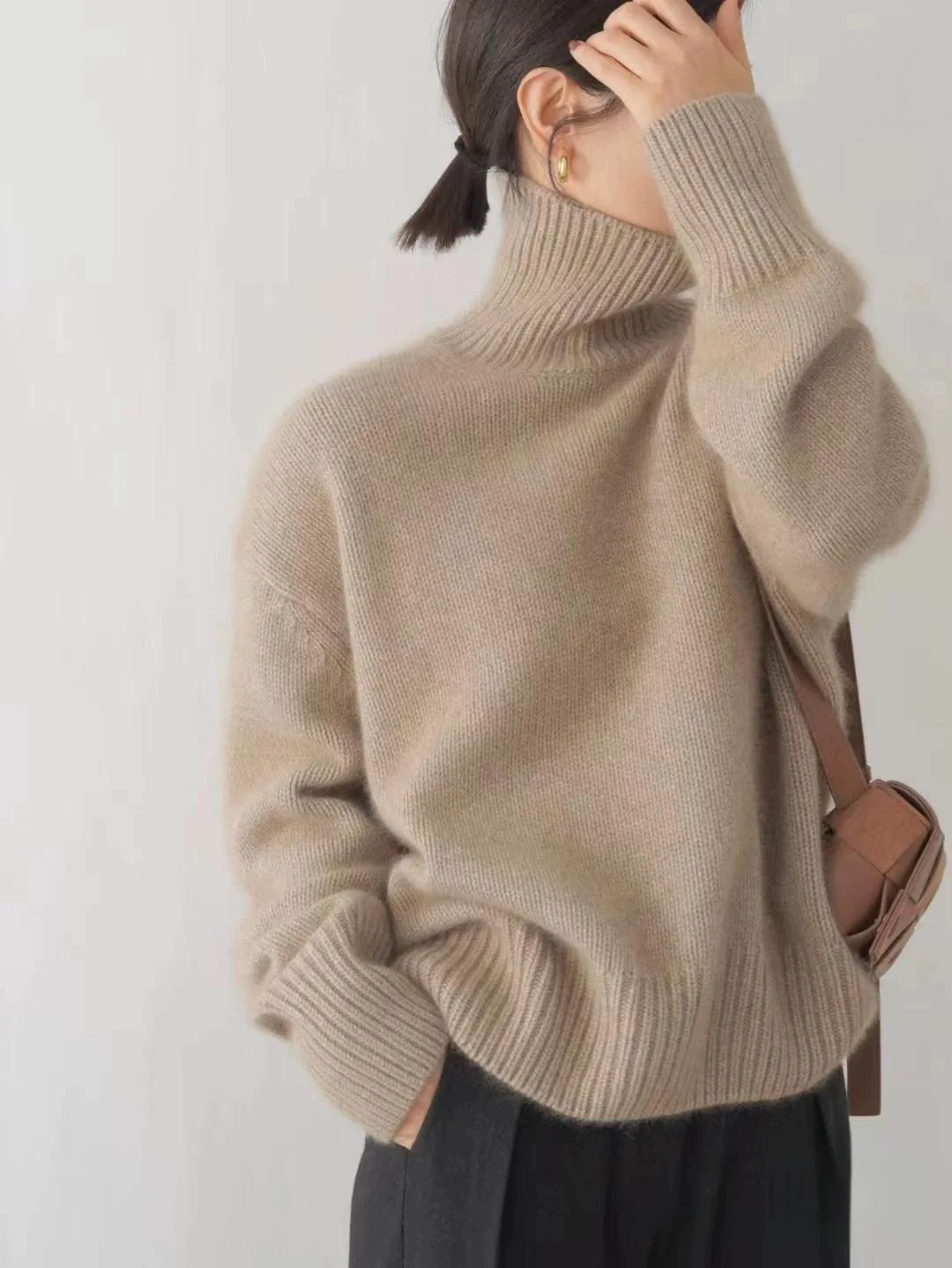 Otoño e Invierno nuevo suéter de lana merina de 100% jersey de punto de cuello alto para mujer tops casuales sueltos de talla grande