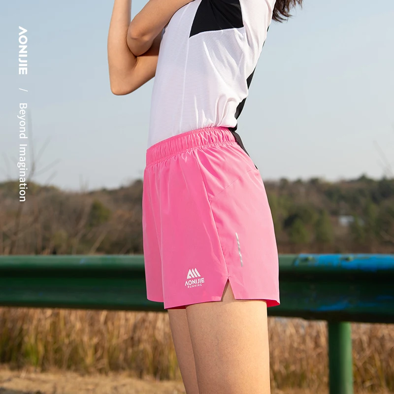AONIJIE FW6199 Pantalones cortos para correr para mujer con bolsillos Pantalones cortos deportivos ligeros de secado rápido Pantalones cortos deportivos para entrenamiento de gimnasio para mujer