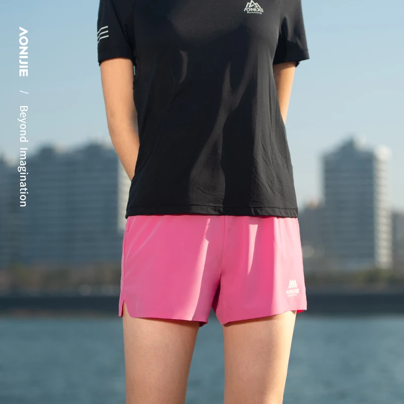 AONIJIE FW6199 Pantalones cortos para correr para mujer con bolsillos Pantalones cortos deportivos ligeros de secado rápido Pantalones cortos deportivos para entrenamiento de gimnasio para mujer