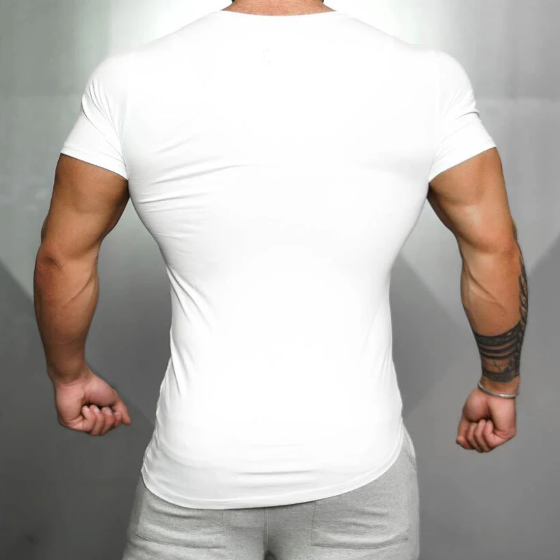 Camiseta deportiva para correr de Color sólido para hombre, camiseta ajustada de manga corta transpirable de algodón, camiseta de entrenamiento físico para culturismo y gimnasio