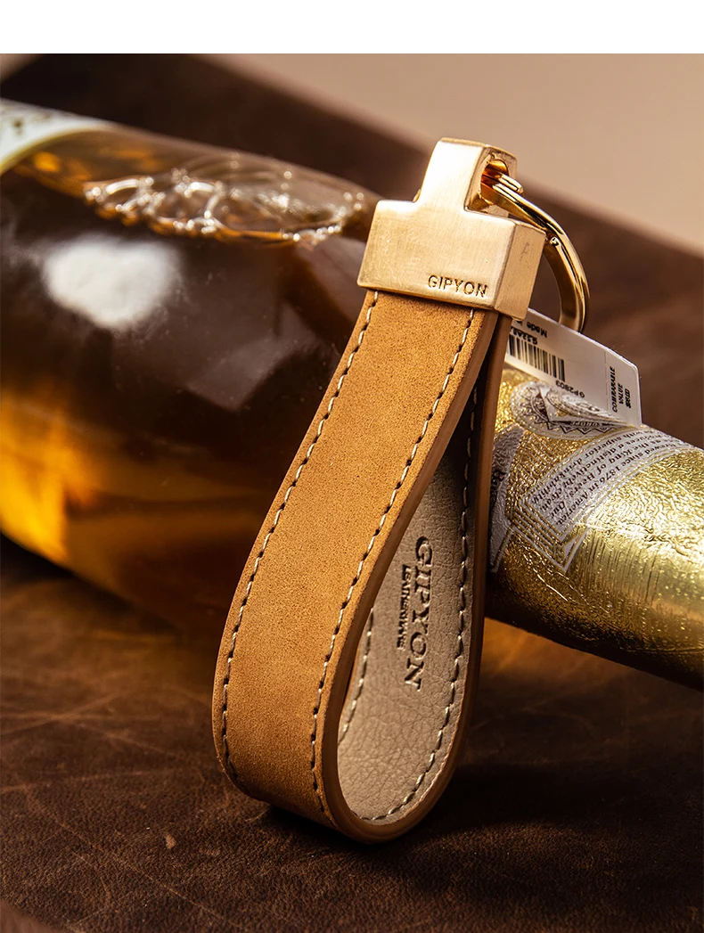Exquisita cuerda de mango de alta calidad, colgante de llavero Simple de cuero de vaca, anillo de cadena de coche con personalidad, colgante para amantes de hombres y mujeres