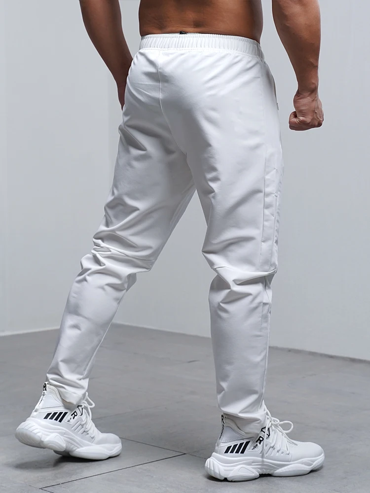 Pantalones Deportivos para Hombre, Transpirables, Holgados, para Correr, Entrenamiento, Gimnasio, Ropa Deportiva, Elásticos, Impermeables, con Bolsillos con Cierre, para Otoño e Invierno
