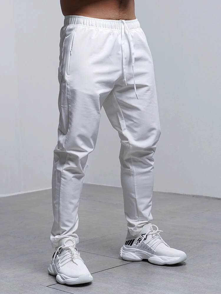Pantalones Deportivos para Hombre, Transpirables, Holgados, para Correr, Entrenamiento, Gimnasio, Ropa Deportiva, Elásticos, Impermeables, con Bolsillos con Cierre, para Otoño e Invierno