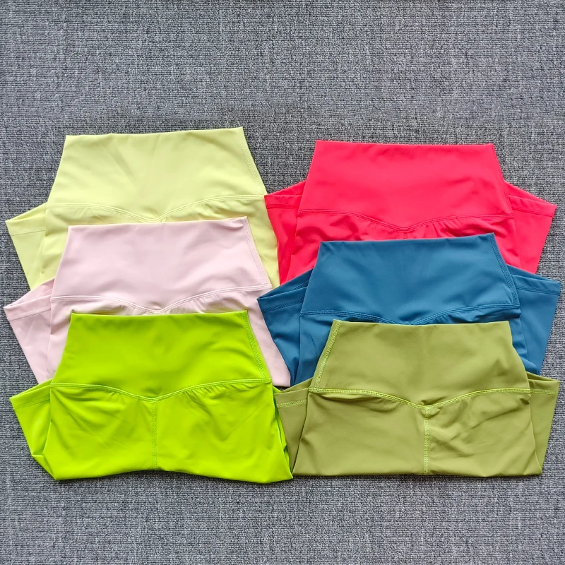 Pantalones cortos deportivos para mujer, pantalones cortos de Yoga de cintura alta, ajustados, levantadores de glúteos, gimnasio, correr, pantalones cortos de nailon de alta elasticidad