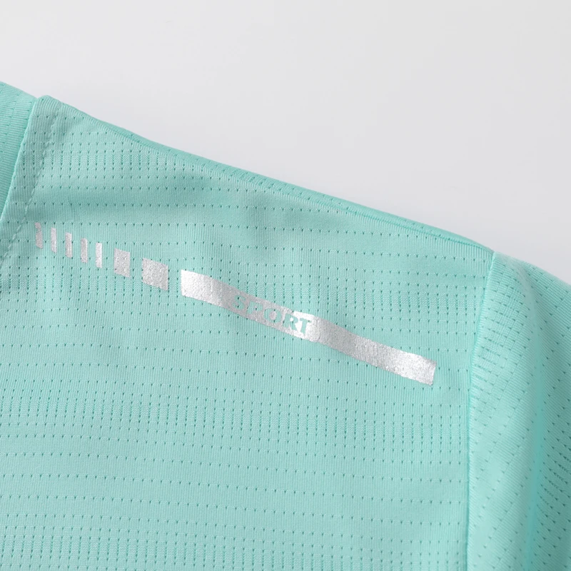 CHRLCK, camiseta de manga corta de malla para mujer, talla US/EU, para correr y hacer ejercicio, de color sólido, transpirable, con tira reflectante