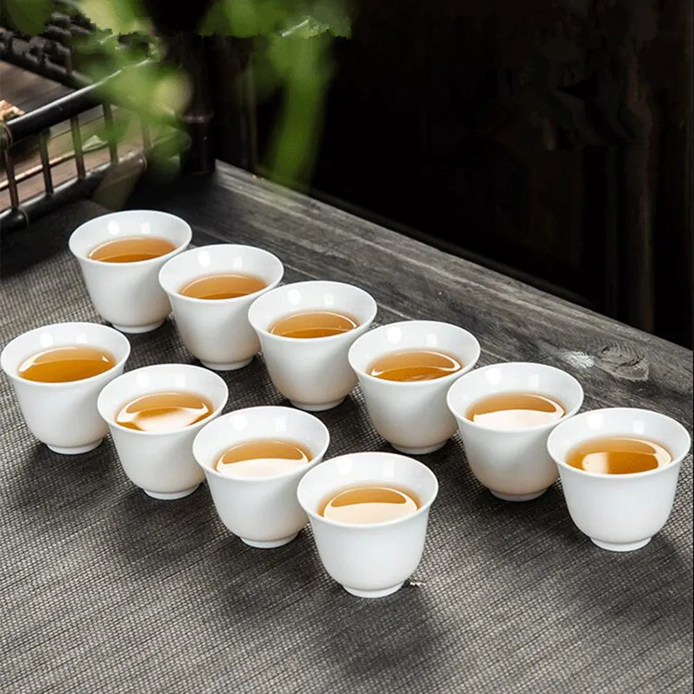 10 unids/pack Dehua porcelana blanca alta taza de té de cerámica blanca pura juego de té de Kungfu hecho a mano juego de tazas de té Pu'er Simple para el hogar