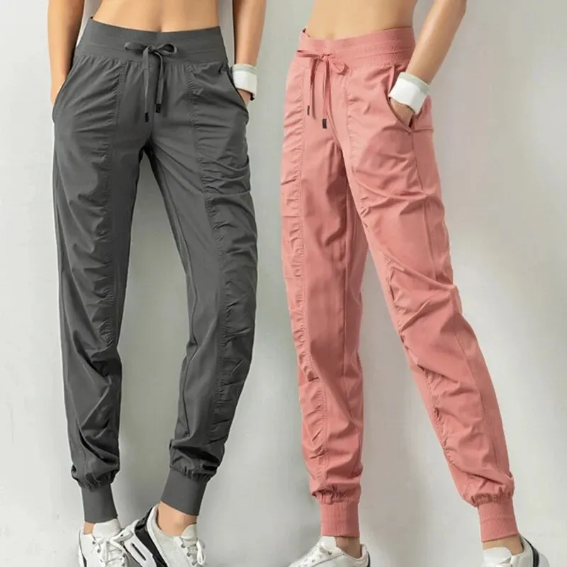 Pantalones deportivos de secado rápido para mujer con dos bolsillos laterales