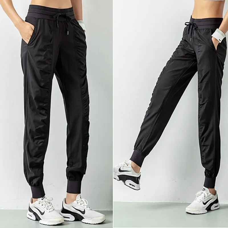 Pantalones deportivos de secado rápido para mujer con dos bolsillos laterales