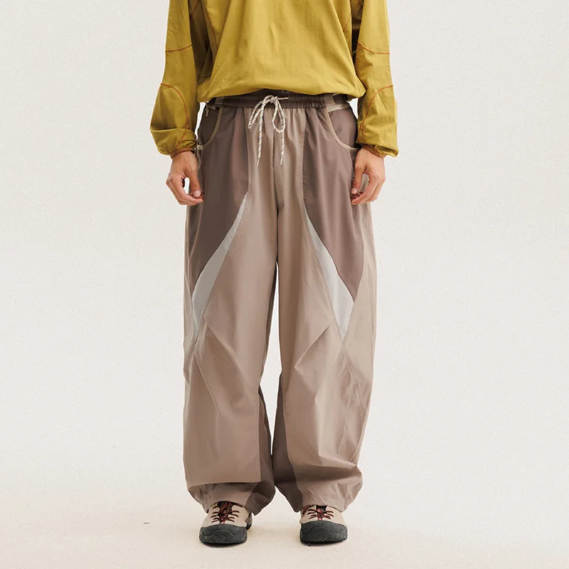 Hombres al aire libre ligero de secado rápido Ultra suelto Casual empalme pierna ancha Techwear pista Cargo pantalones mujeres ropa de calle pantalones holgados