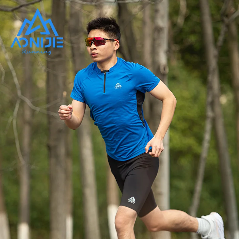 AONIJIE-Camiseta deportiva de secado rápido para hombre, camisa de manga corta con cremallera y cuello redondo, transpirable, para Fitness y ciclismo, FM5158