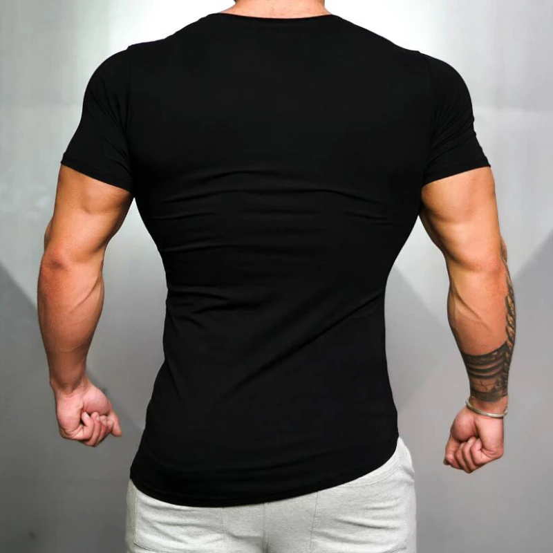 Camiseta deportiva para correr de Color sólido para hombre, camiseta ajustada de manga corta transpirable de algodón, camiseta de entrenamiento físico para culturismo y gimnasio