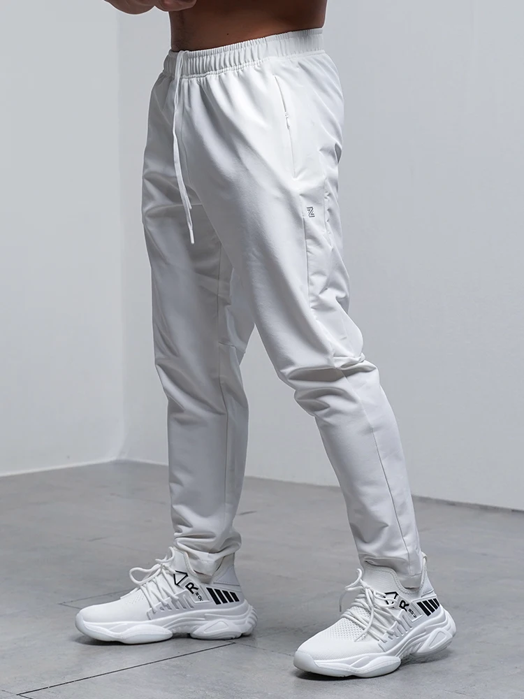 Pantalones Deportivos para Hombre, Transpirables, Holgados, para Correr, Entrenamiento, Gimnasio, Ropa Deportiva, Elásticos, Impermeables, con Bolsillos con Cierre, para Otoño e Invierno