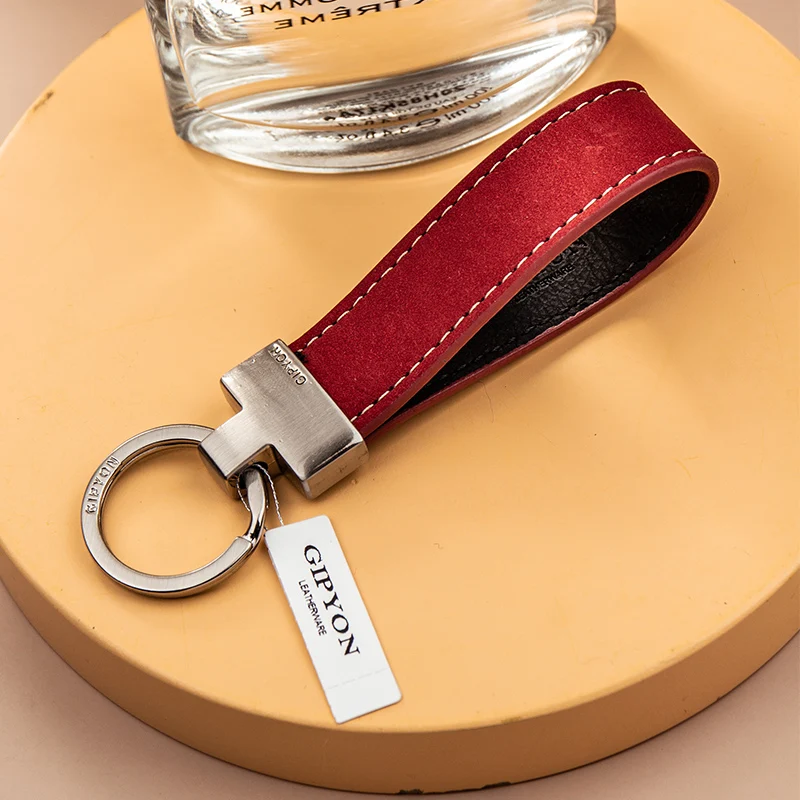 Exquisita cuerda de mango de alta calidad, colgante de llavero Simple de cuero de vaca, anillo de cadena de coche con personalidad, colgante para amantes de hombres y mujeres