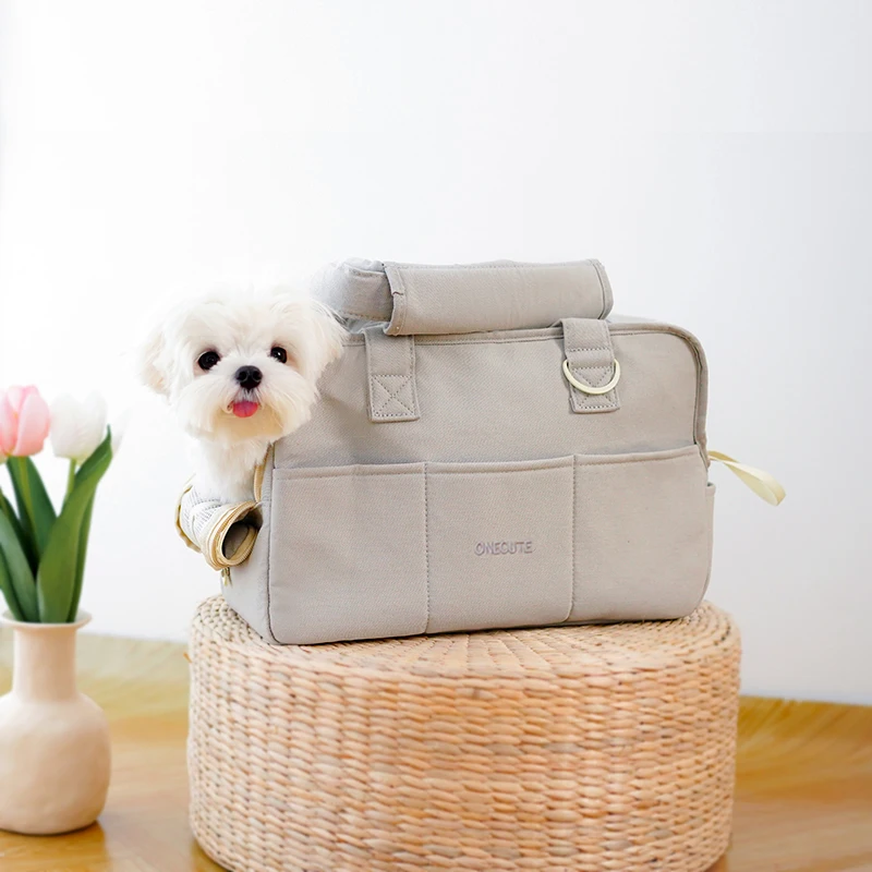 Mascotas Salen de Casa y Llevan a los Cachorros con ellos. Bolsos portátiles de un solo hombro adecuados para transportar gatos y perros pequeños al aire libre, más que los osos.