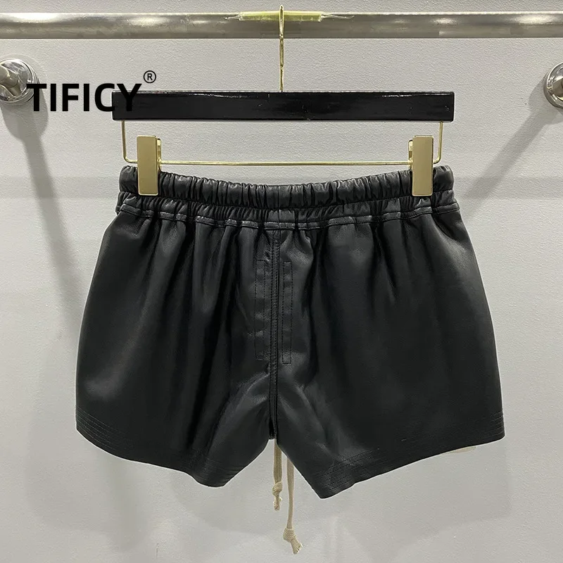 Pantalones cortos cómodos con cuatro bolsillos en las esquinas de cuero PU básico a la moda para mujer nuevos pantalones cortos negros versátiles